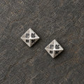 Pair of oxidized silver pyramid stud earrings featuring four playing card suits