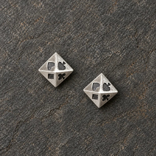 Pair of oxidized silver pyramid stud earrings featuring four playing card suits