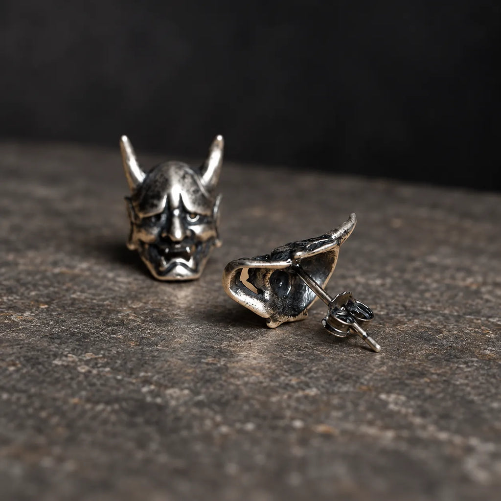 Front and back view of Hannya mask stud earrings showing the hollow back, post and butterfly closure