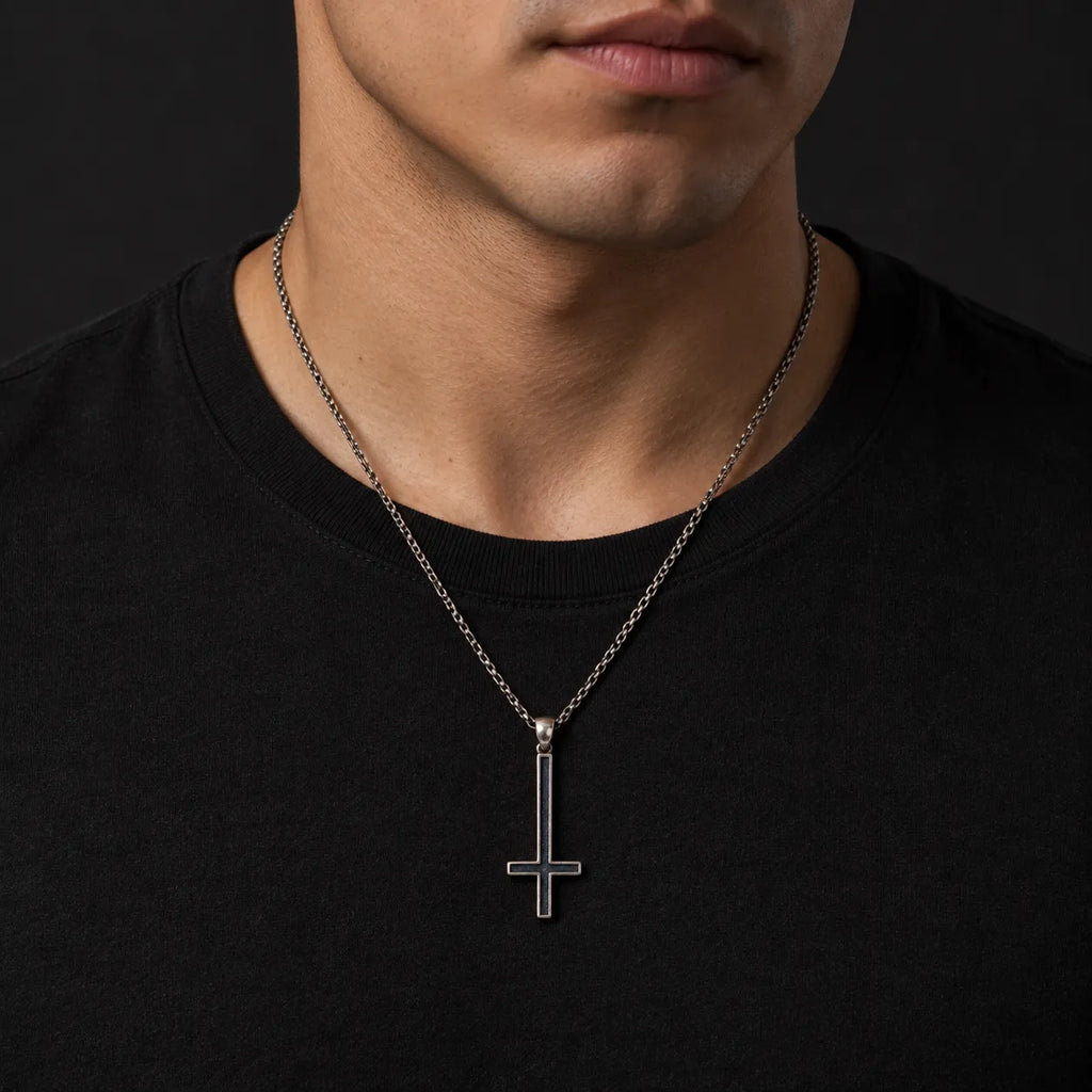 Inverted cross pendant worn at its actual 16 by 41 mm size on an optional silver chain