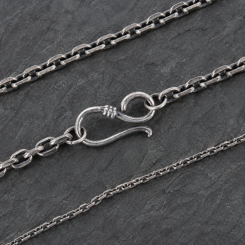 Close-up comparison of oxidized silver chain links and the S-hook clasp used on the 3.0 mm size