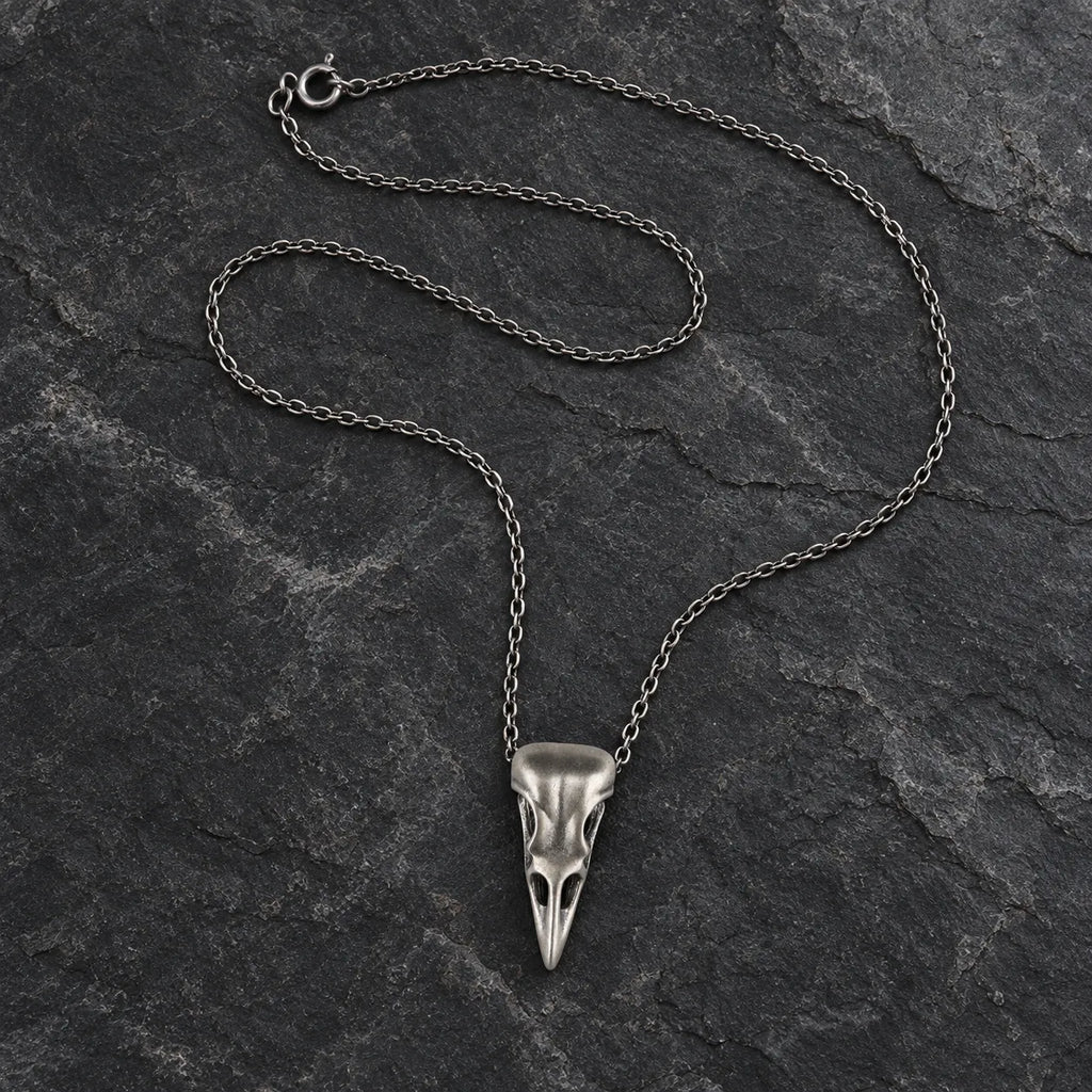 Oxidized silver raven skull pendant displayed with an optional 2.0 mm cable chain