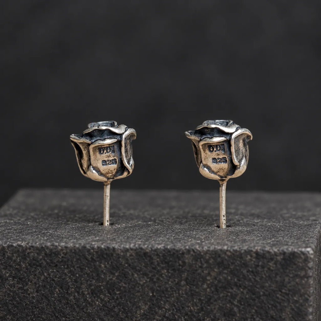 Back view of rose stud earrings showing the recessed backs and straight posts