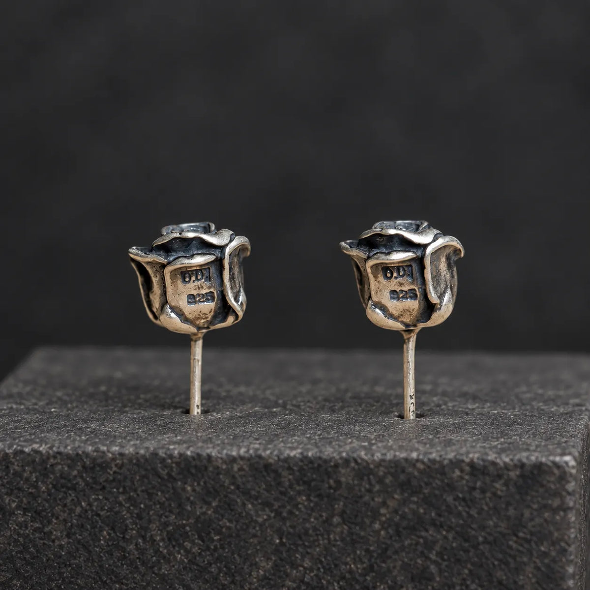 Back view of rose stud earrings showing the recessed backs and straight posts