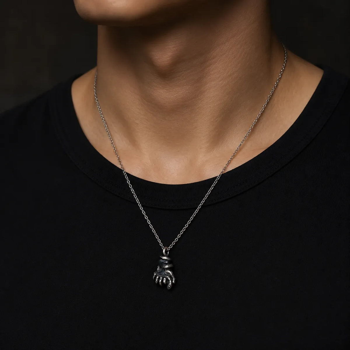 Serpent hand pendant worn at its actual 15 by 27 mm size on a 2.0 mm chain
