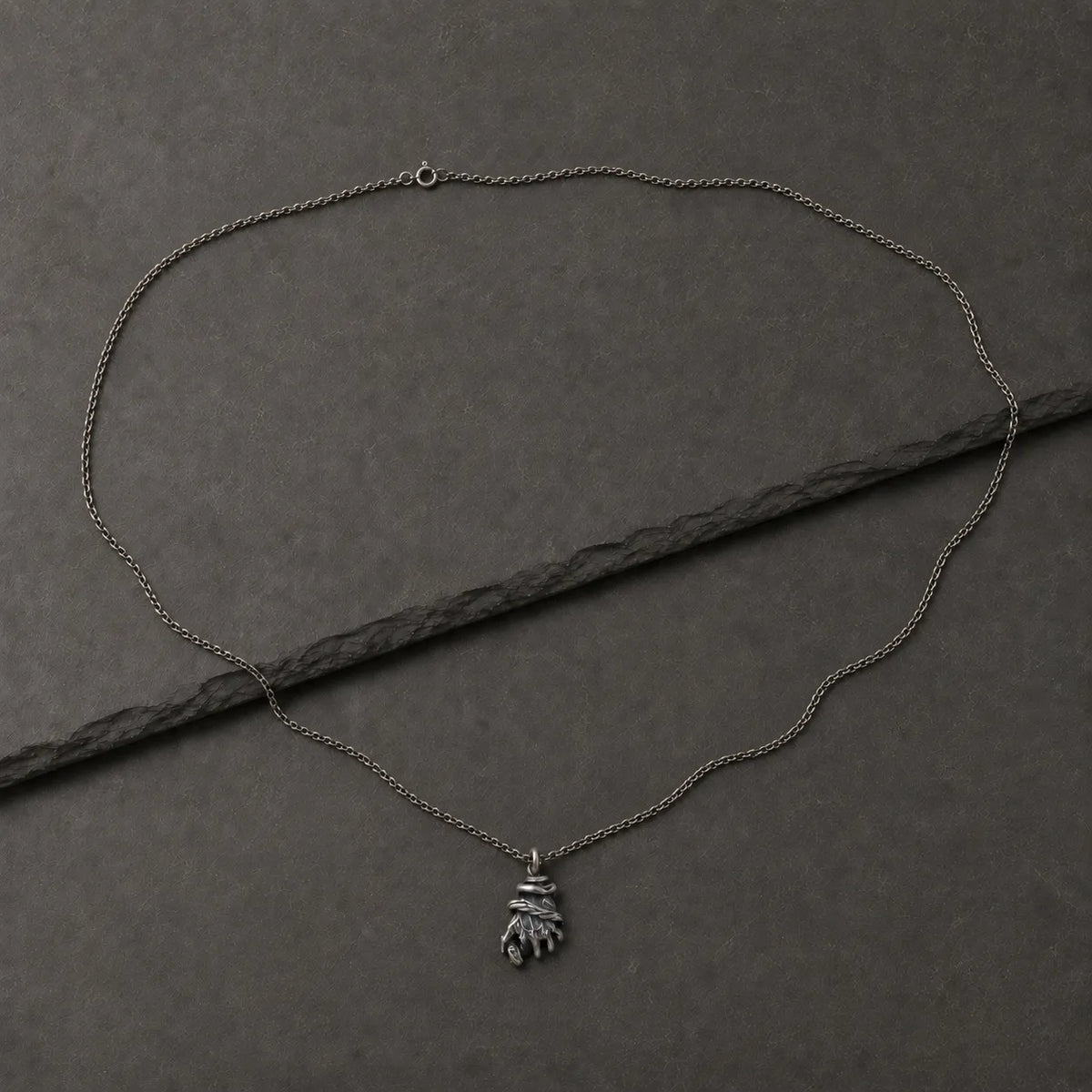 Oxidized silver chain paired with the Serpent’s Grasp Hand Pendant, sold separately