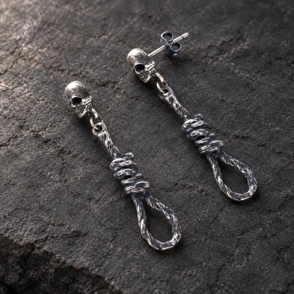 Angled view of skull and noose earrings showing their straight posts and butterfly backs