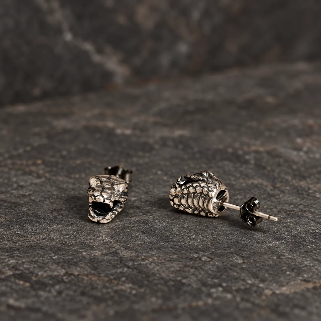 Front and rear-side views of snake head stud earrings showing the post and hollow back