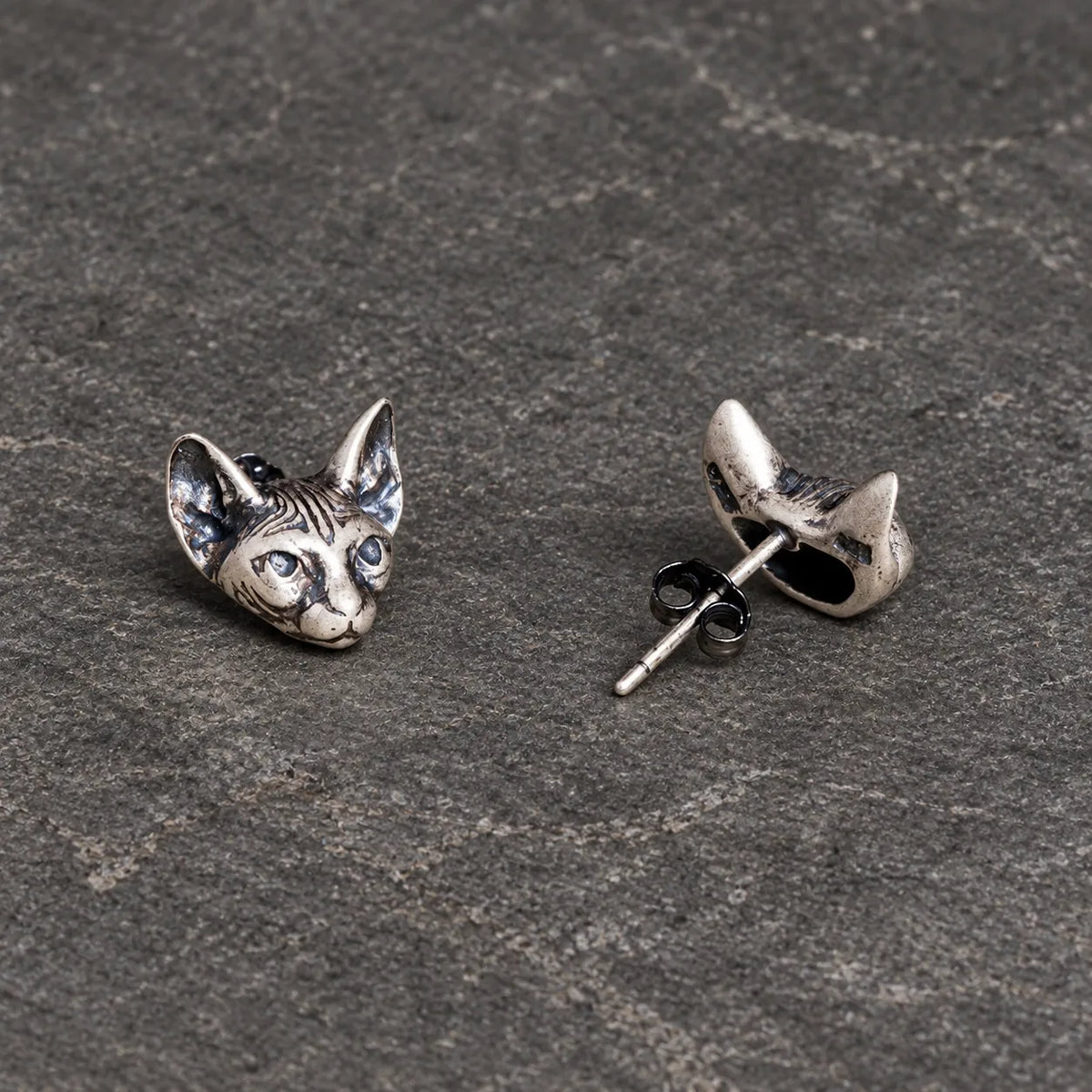 Front and back views of Sphynx cat stud earrings showing the straight post and butterfly back