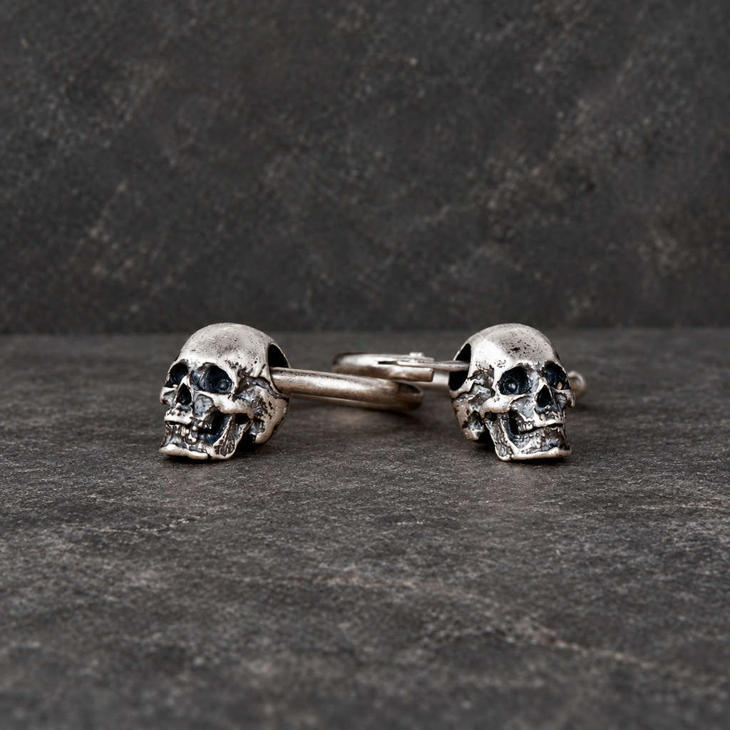 Low front view highlighting the sculpted skull faces and oxidized details， closer look